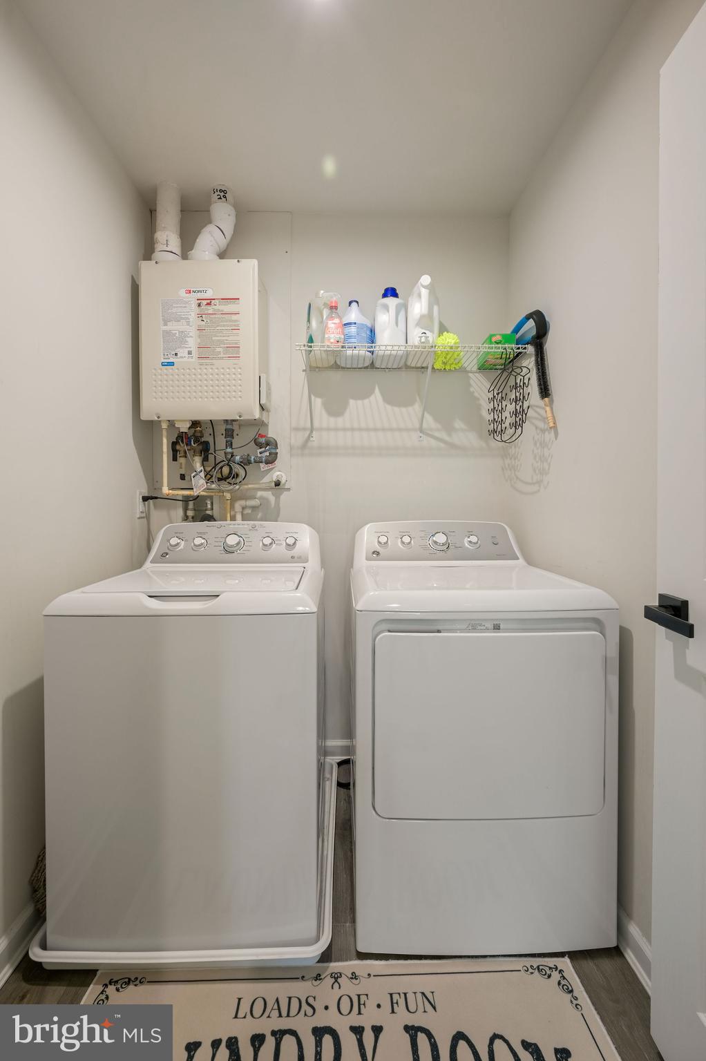 343 Sedimentary Rock Road Dover, DE 19904 - Photo 27 of 27 a utility room with dryer and washer