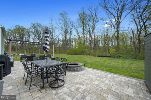 a view of a patio with a table chairs and a patio