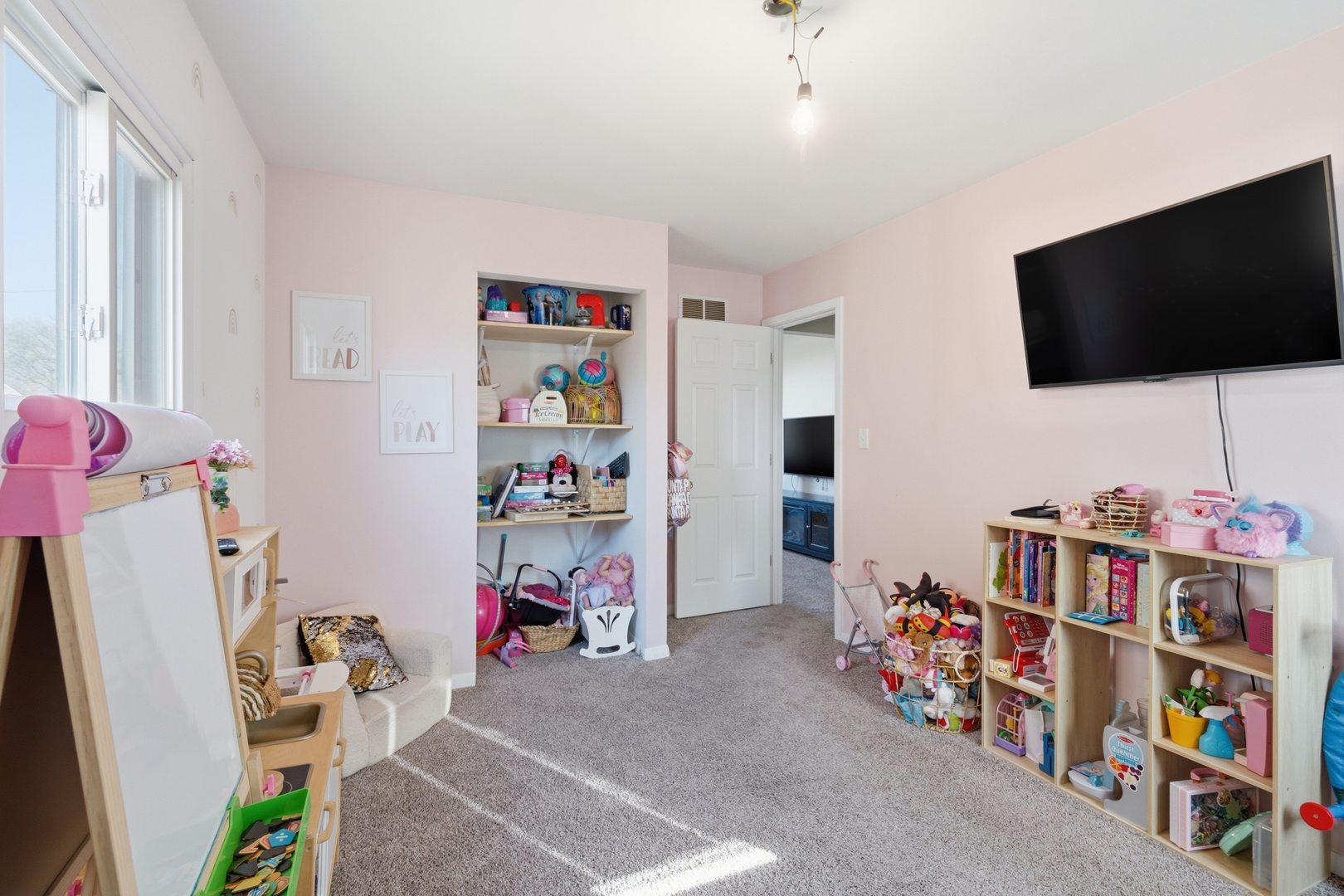 3443 3rd Street B East Moline, IL 61244 - Photo 11 of 23 a children room with toys and a flat screen tv