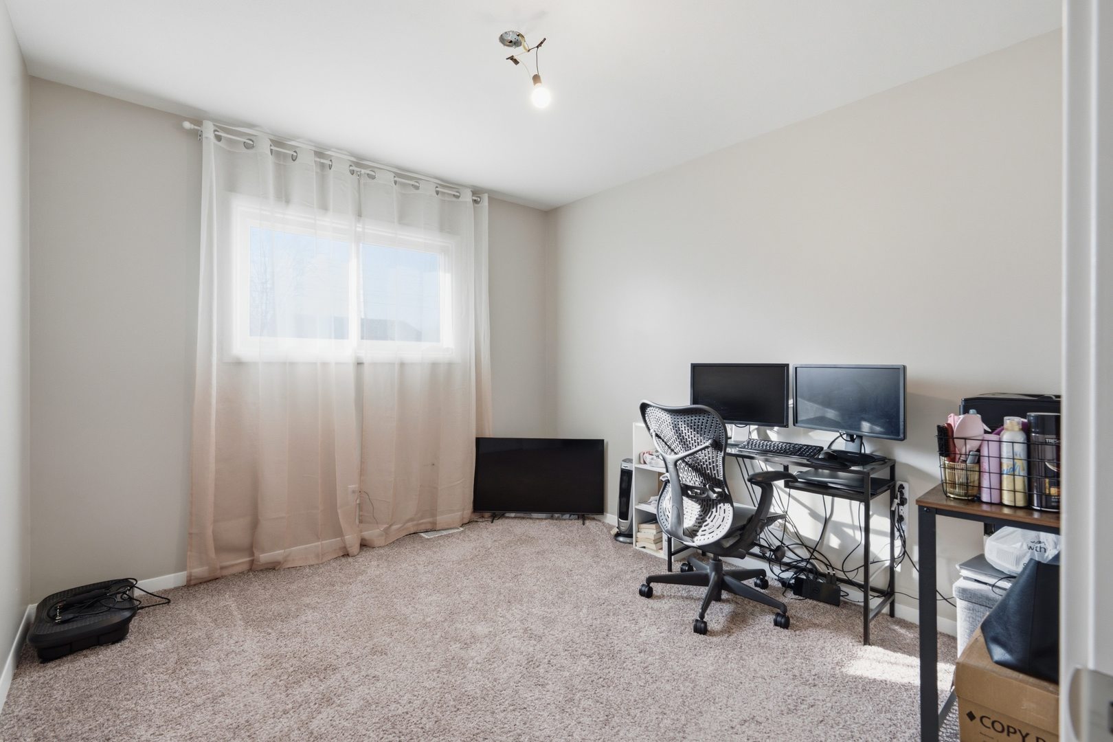 3443 3rd Street B East Moline, IL 61244 - Photo 12 of 23 a view of a workspace with furniture and a window