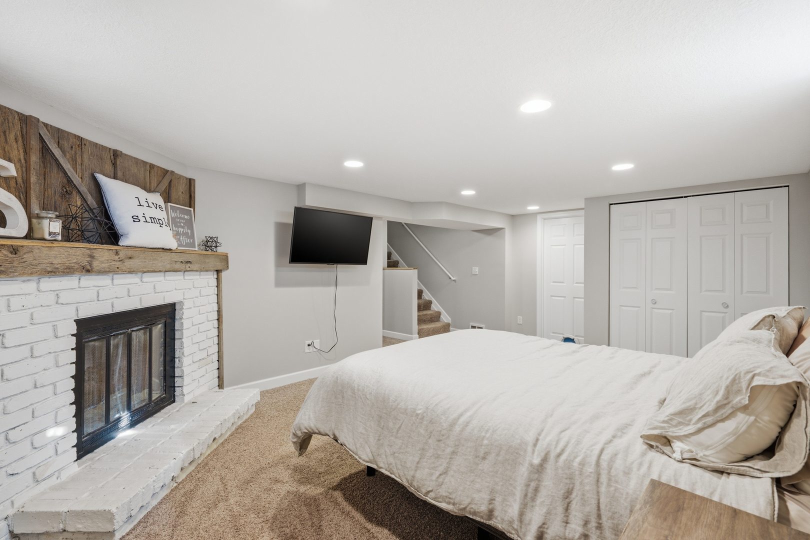 3443 3rd Street B East Moline, IL 61244 - Photo 17 of 23 a spacious bedroom with a bed and a flat screen tv