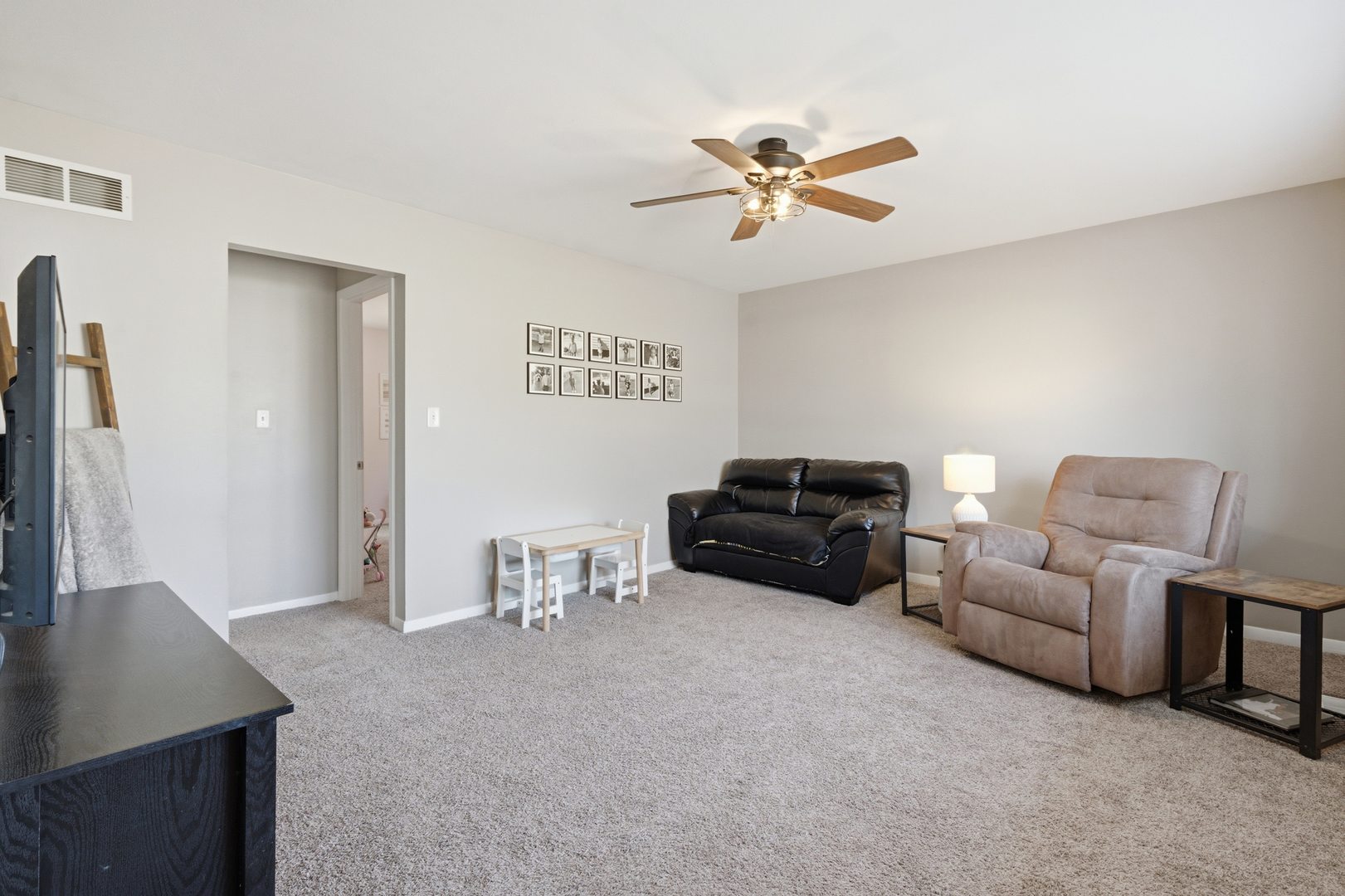 3443 3rd Street B East Moline, IL 61244 - Photo 2 of 23 a living room with furniture and a flat screen tv