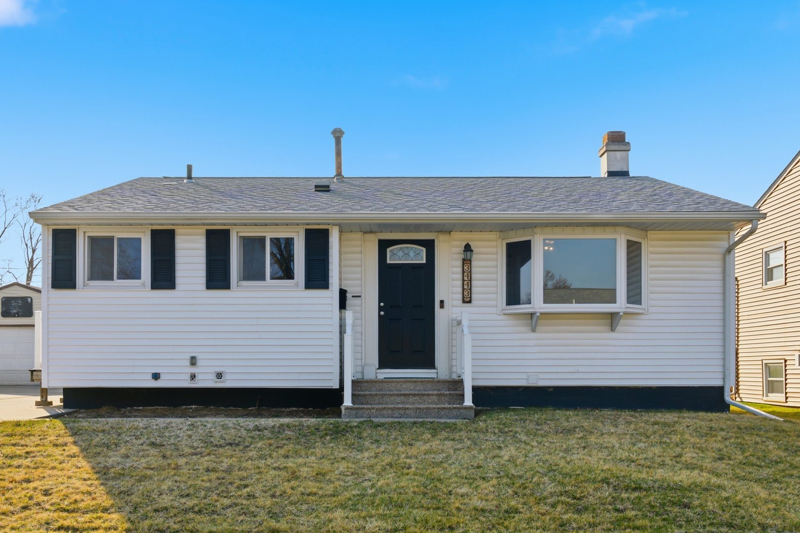 3443 3rd Street B East Moline, IL 61244 - Photo 22 of 23 a front view of a house with garden
