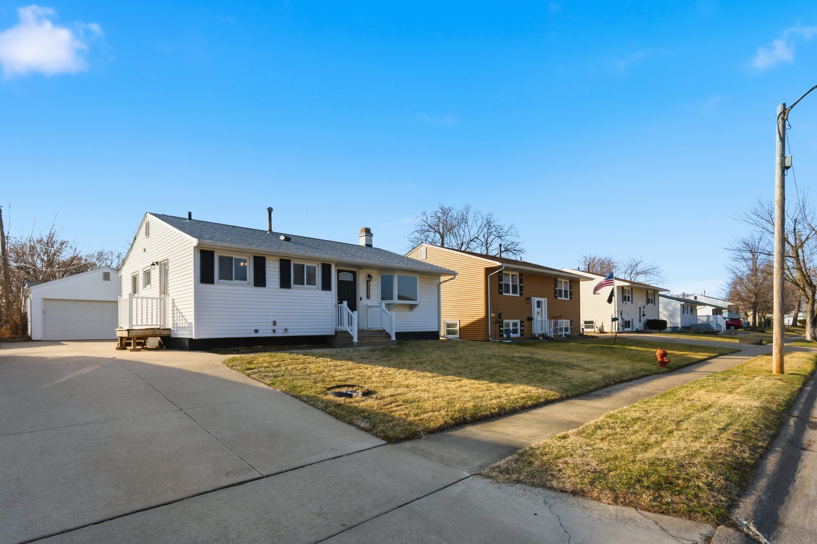 3443 3rd Street B East Moline, IL 61244 - Photo 23 of 23 a view of a big house with a big yard and large tree