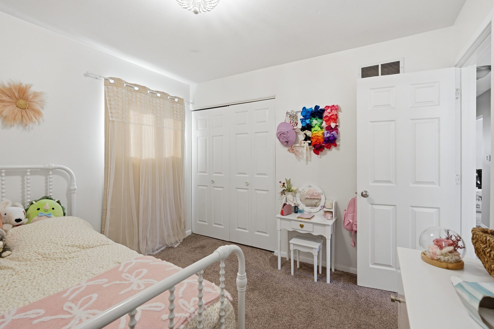 3443 3rd Street B East Moline, IL 61244 - Photo 9 of 23 a bedroom with a bed table chair and a potted plant