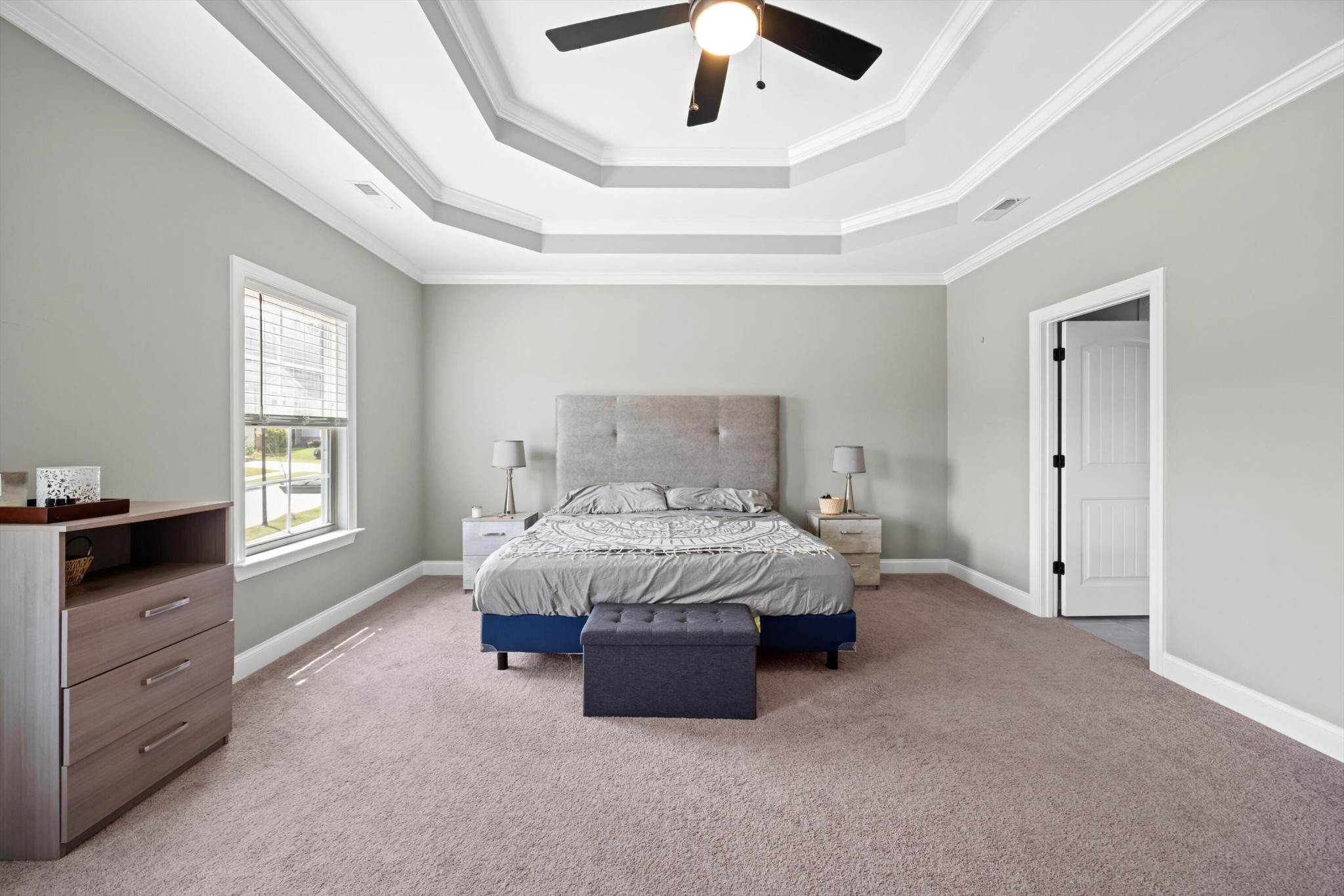 3569 Weathervane Loop Apison, TN 37302 - Photo 18 of 36 a spacious bedroom with a bed and a ceiling fan