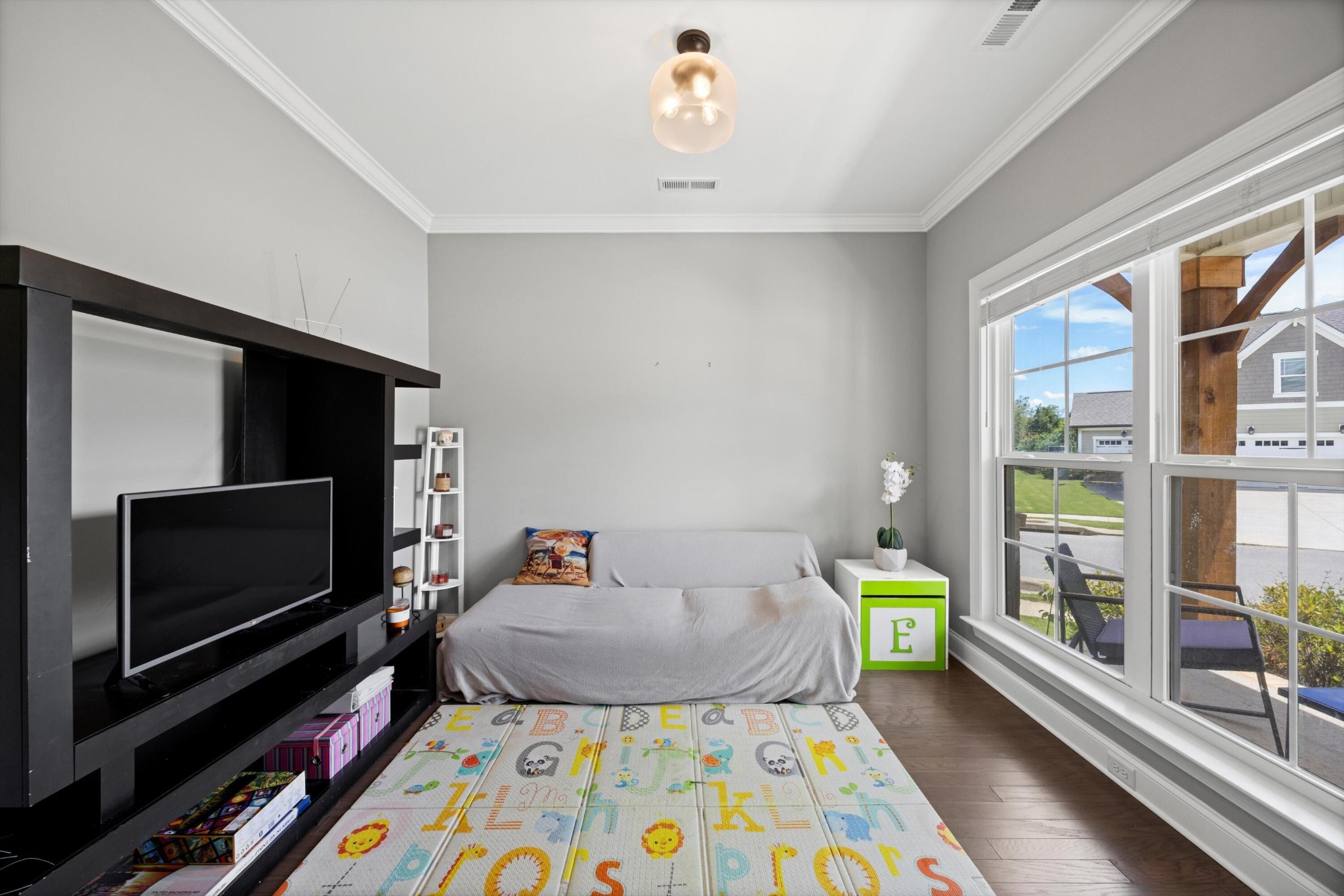 3569 Weathervane Loop Apison, TN 37302 - Photo 24 of 36 a bed room with furniture and a flat screen tv