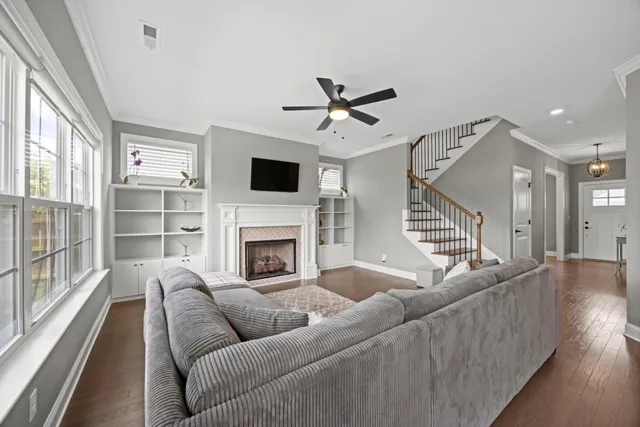 a living room with furniture fireplace and flat screen tv
