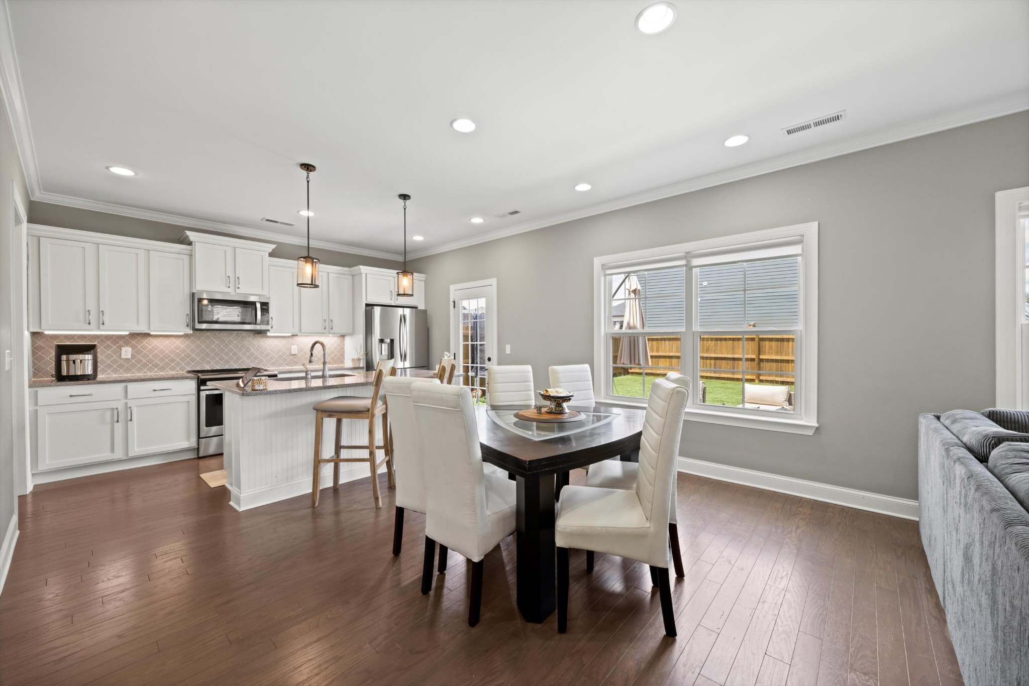 3569 Weathervane Loop Apison, TN 37302 - Photo 10 of 36 a kitchen with a table chairs refrigerator and cabinets