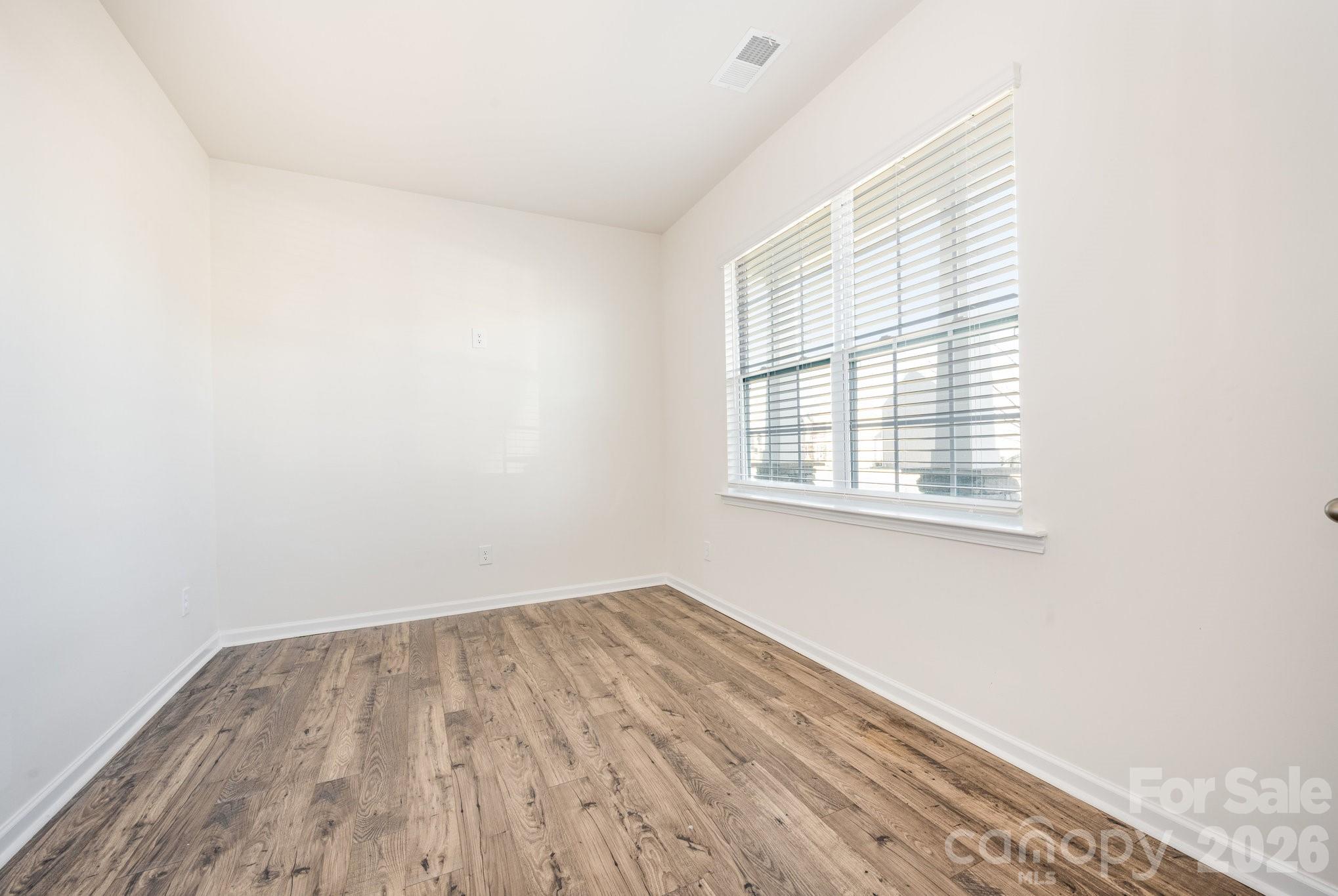 2116 Vanderlyn Street Monroe, NC 28112 - Photo 14 of 20 an empty room with a window