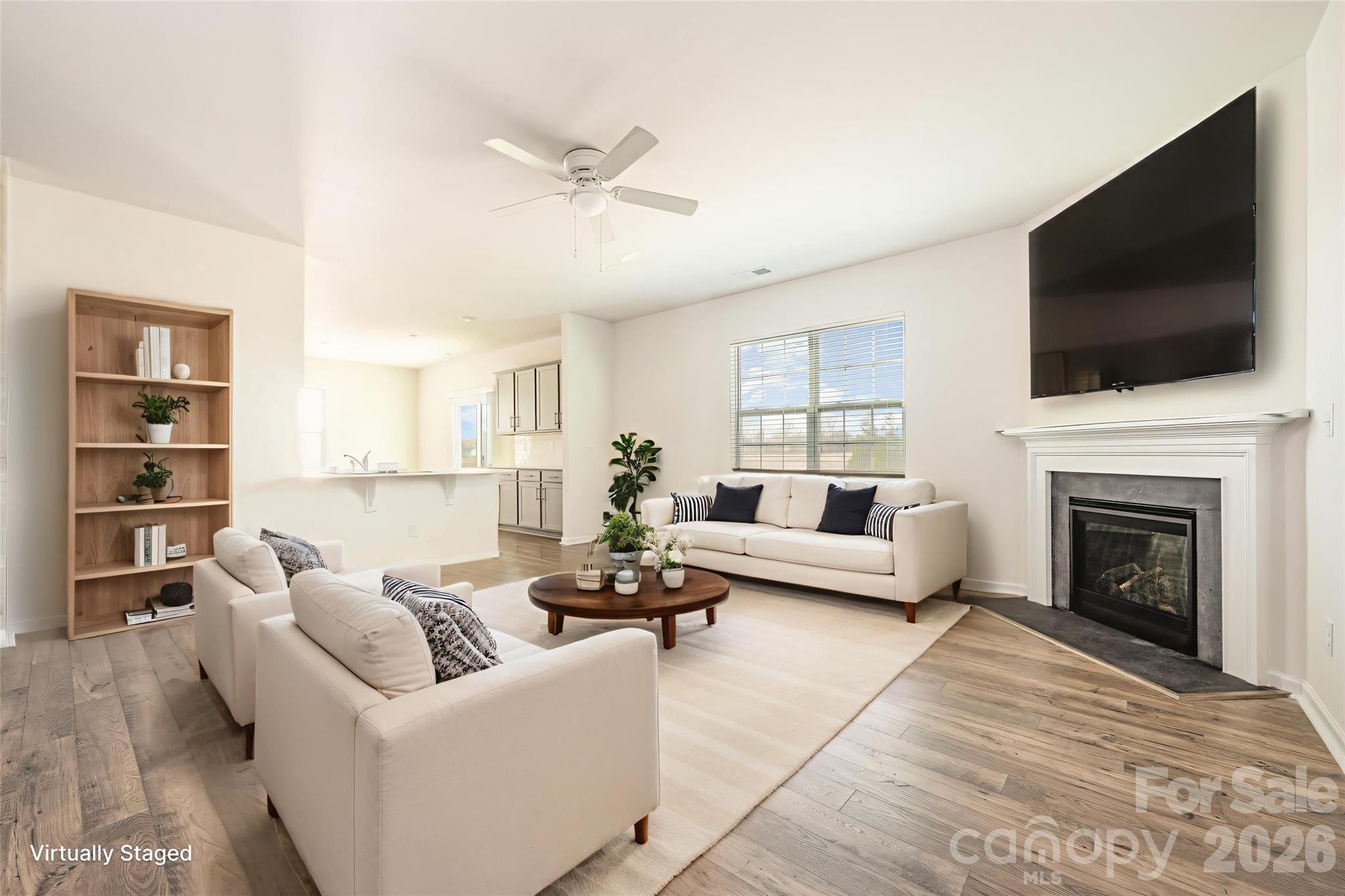 2116 Vanderlyn Street Monroe, NC 28112 - Photo 2 of 20 a living room with furniture fireplace and flat screen tv