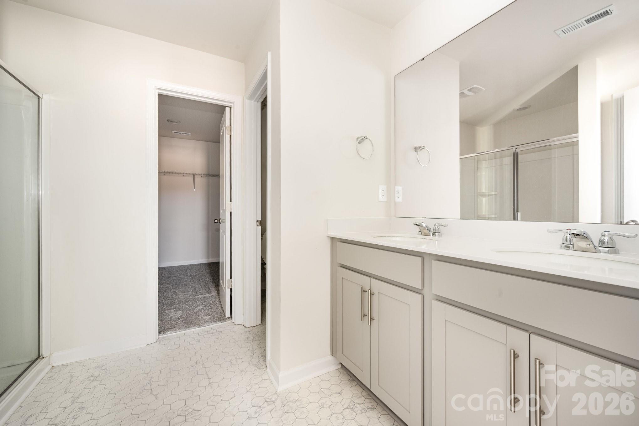 2116 Vanderlyn Street Monroe, NC 28112 - Photo 9 of 20 a bathroom with a double vanity sink and a mirror