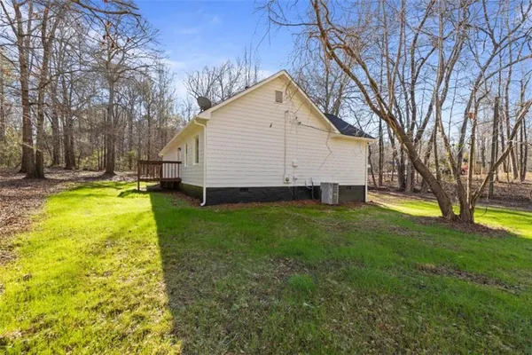 a view of a house with a yard and swimming pool
