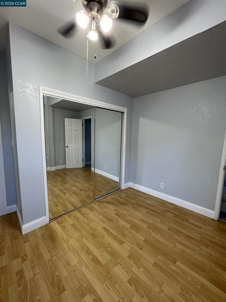 1705 Linden Street Oakland, CA 94607 - Photo 15 of 22 a view of an empty room with a chandelier fan