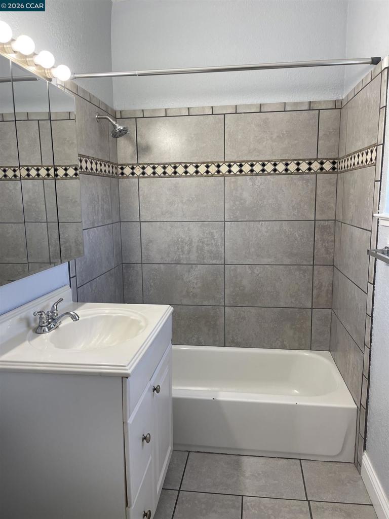 1705 Linden Street Oakland, CA 94607 - Photo 18 of 22 a bathroom with a bathtub a shower a sink and vanity