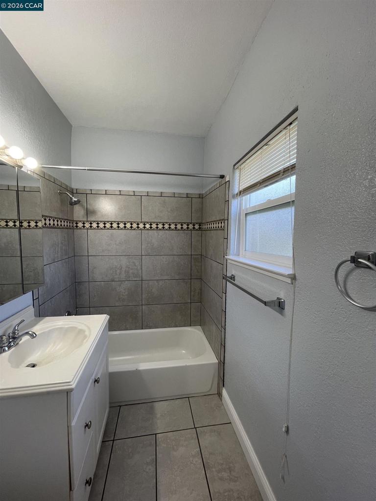 1705 Linden Street Oakland, CA 94607 - Photo 21 of 22 a bathroom with a sink a toilet and shower
