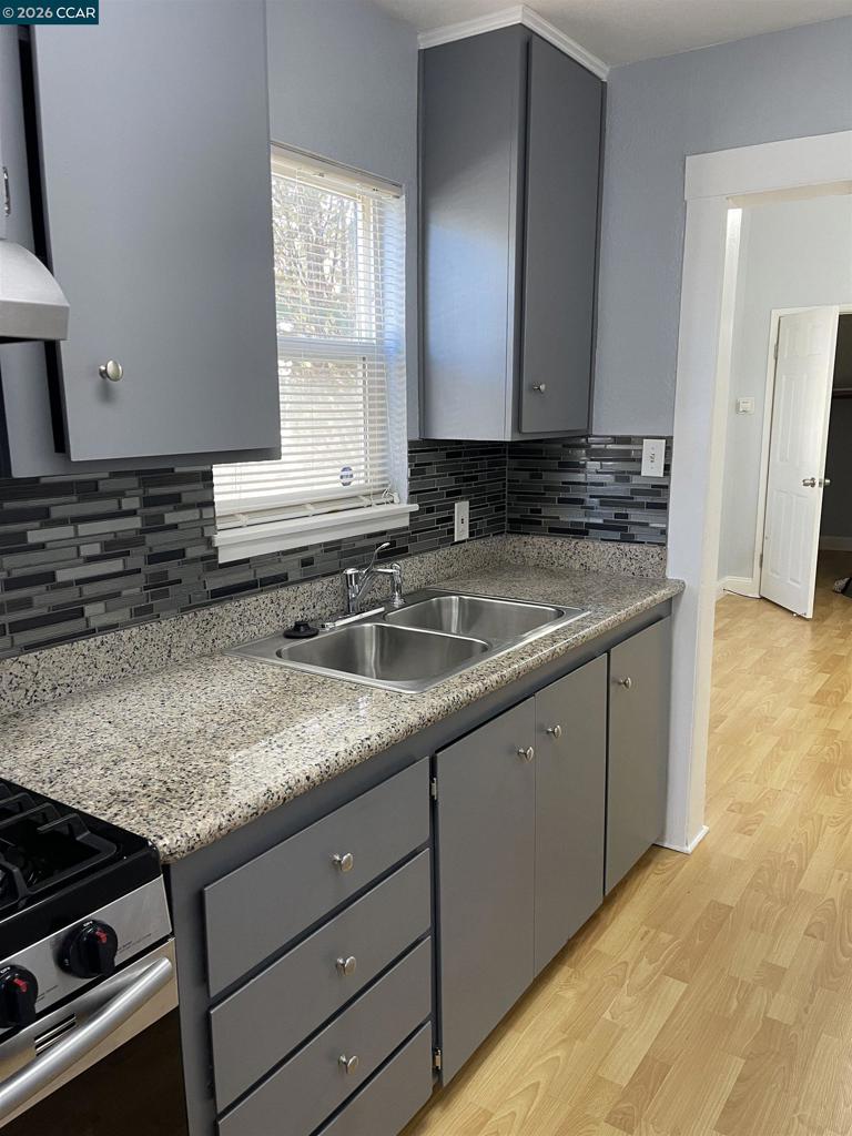 1705 Linden Street Oakland, CA 94607 - Photo 5 of 22 a kitchen with sink and mirror