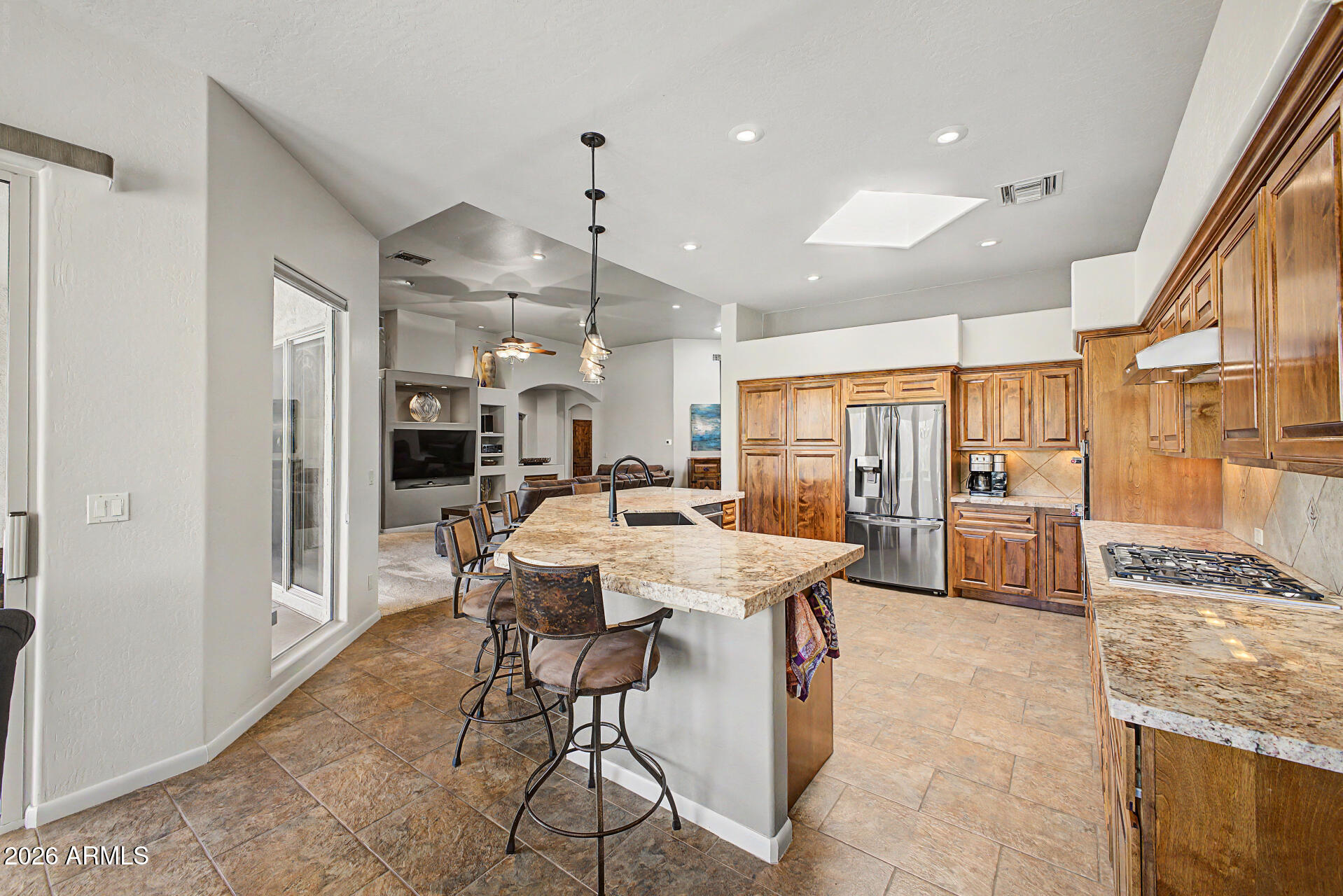 27909 North Quail Spring Road Rio Verde, AZ 85263 - Photo 11 of 52 a large kitchen with a table and chairs
