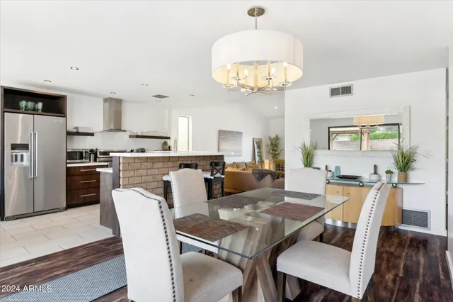 a spacious bedroom with a bed and a view of bedroom