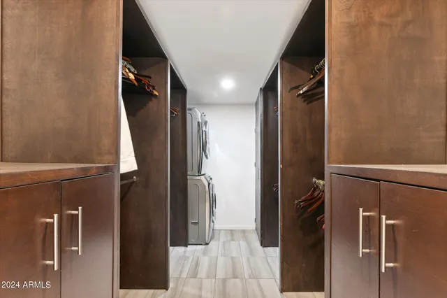 a bedroom with a large bed and a couch