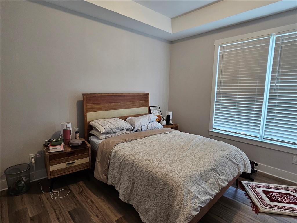 732 Perch Place Atlanta, GA 30312 - Photo 11 of 25 a bedroom with a bed and wooden floor