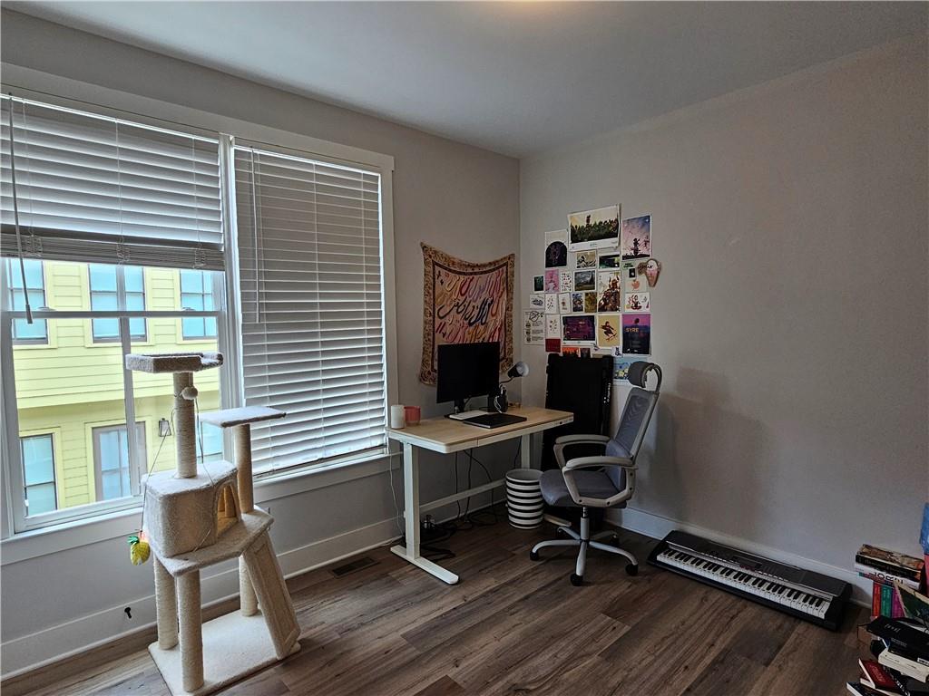 732 Perch Place Atlanta, GA 30312 - Photo 14 of 25 a workspace with wooden floor and a window
