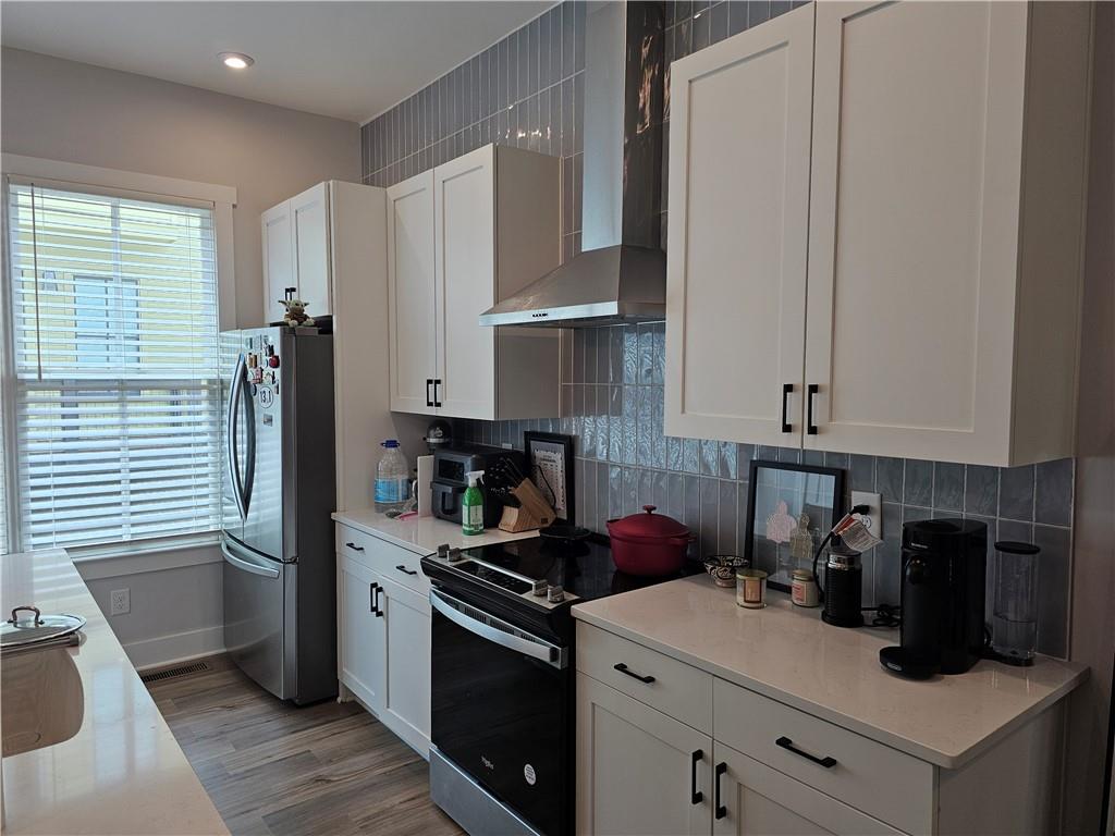 732 Perch Place Atlanta, GA 30312 - Photo 2 of 25 a kitchen with a refrigerator stove and sink