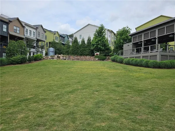 a view of a building next to a big yard