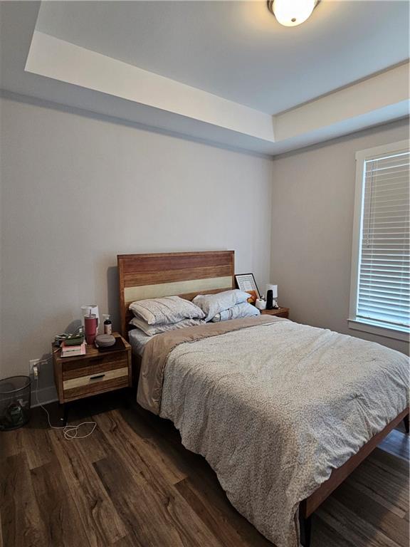 732 Perch Place Atlanta, GA 30312 - Photo 10 of 25 a bedroom with a bed and wooden floor