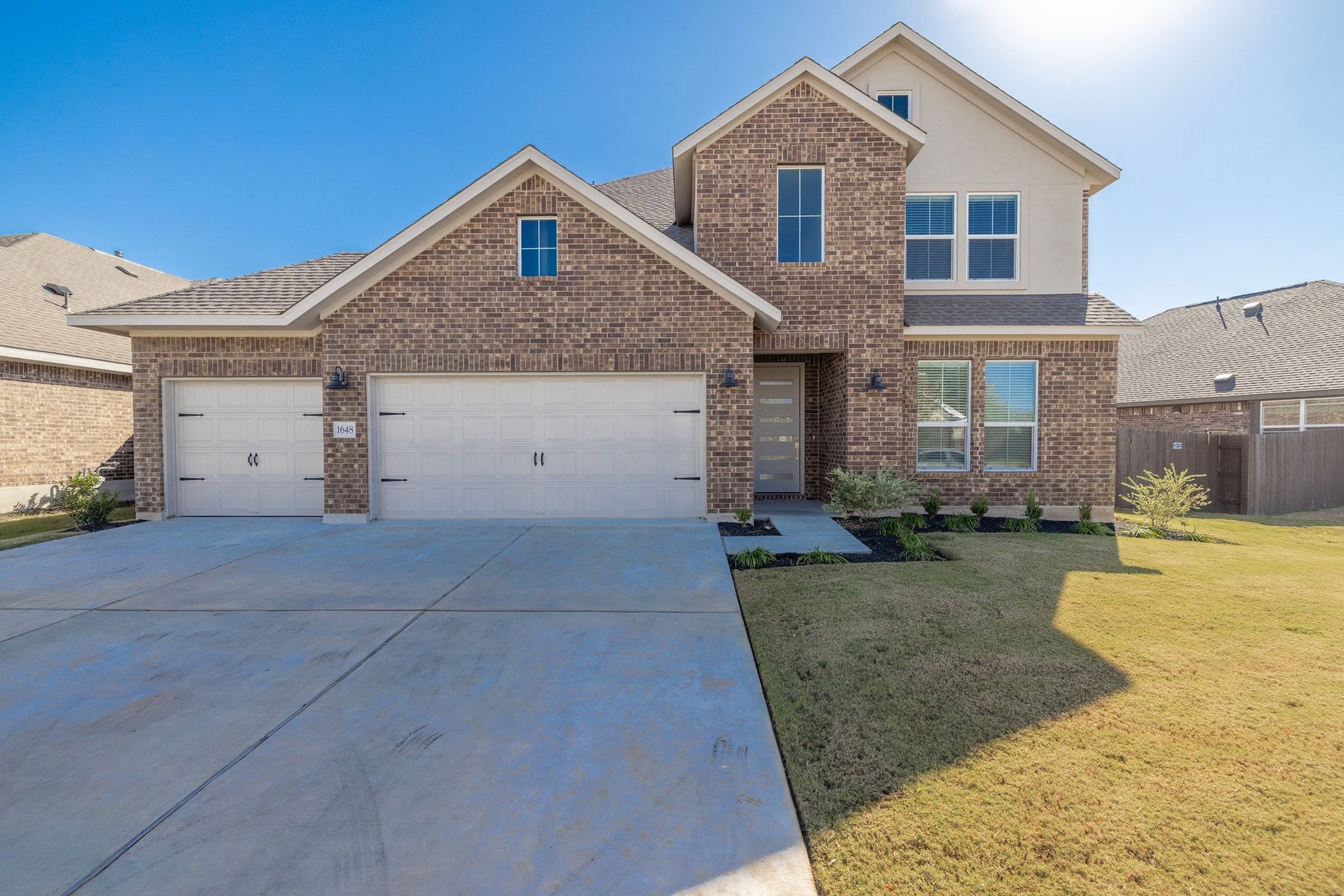 1648 Tinnen House Street Georgetown, TX 78628 - Photo 1 of 1 a front view of a house with a yard and garage