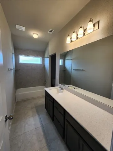 an empty room with sliding door and wooden floor