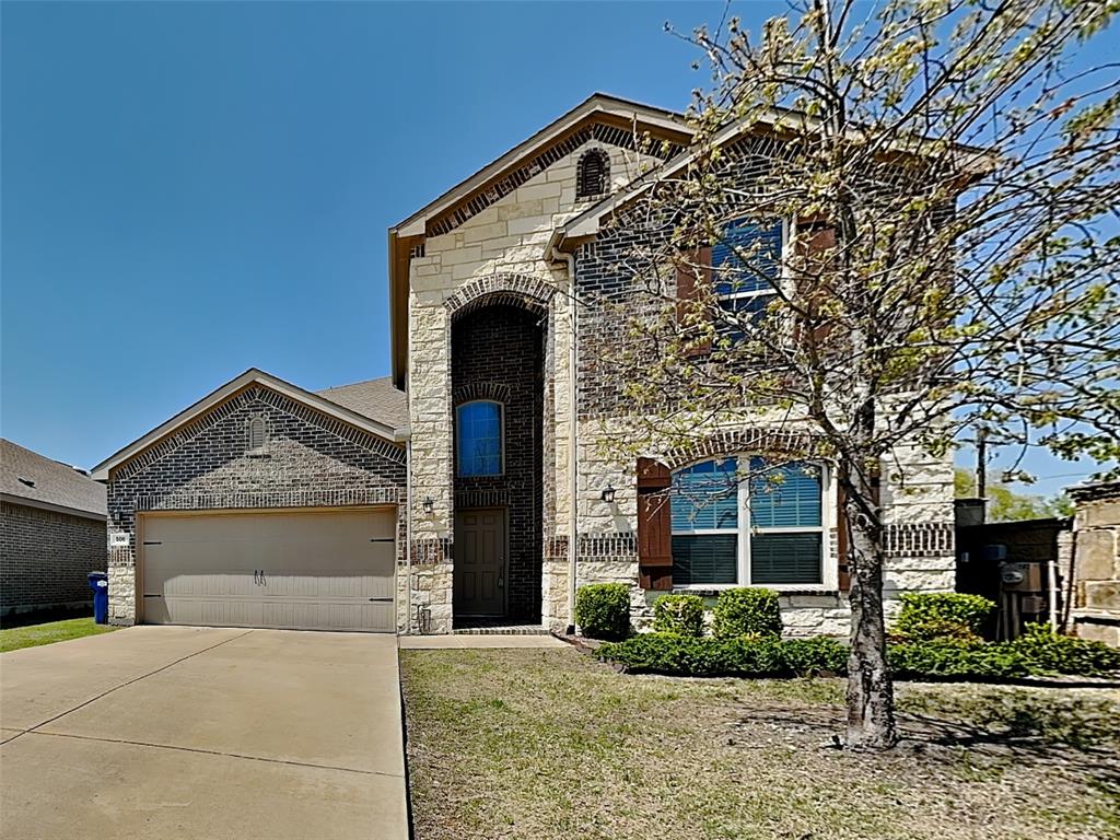 506 Robinson Way Fate, TX 75189 - Photo 1 of 30 French country inspired facade featuring stone siding, driveway, brick siding, a garage, and a front yard