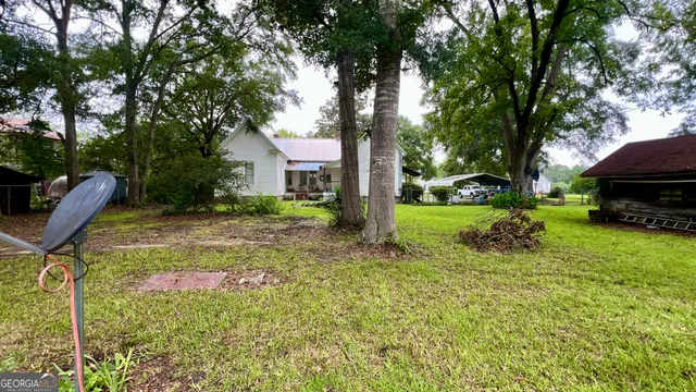 a view of a field with an trees