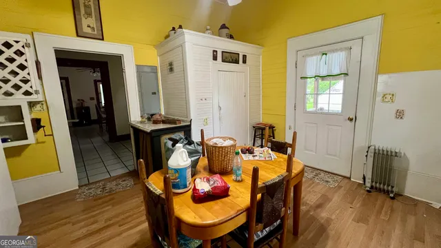 a kitchen with stainless steel appliances a stove a sink and cabinets