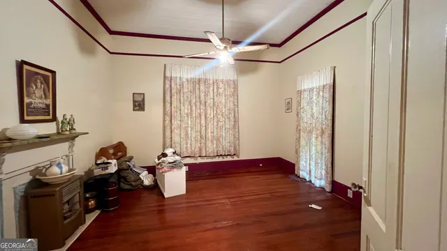 a view of a livingroom with furniture and a window