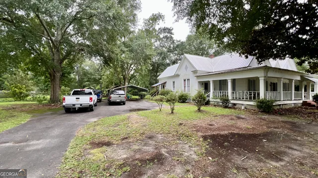 a front view of a house with garden