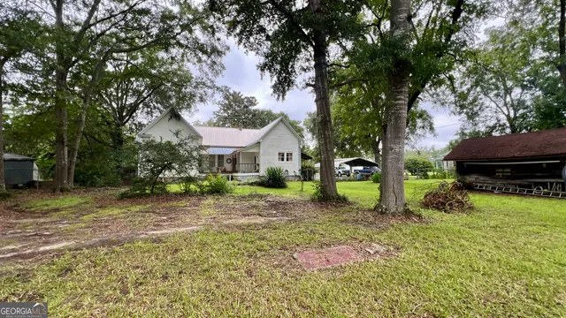 a view of backyard with a garden and entertaining space