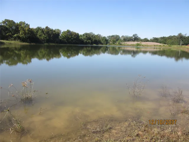 an aerial view of a houses with a yard