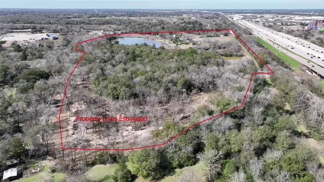 a view of a lake with a house in the background