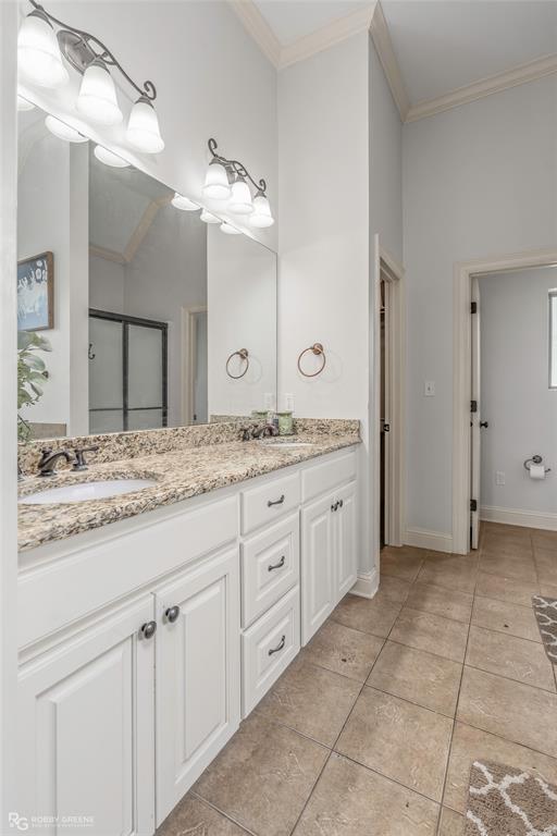 711 Reeds Reef Bossier City, LA 71112 - Photo 19 of 36 a spacious bathroom with a granite countertop sink a mirror and a