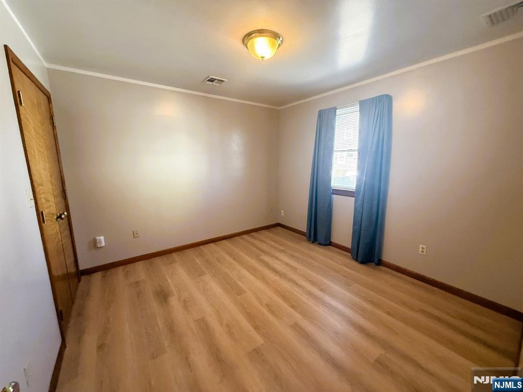 47 Harding Court, Unit 2 Garfield, NJ 07026 - Photo 11 of 34 a view of an empty room with a window