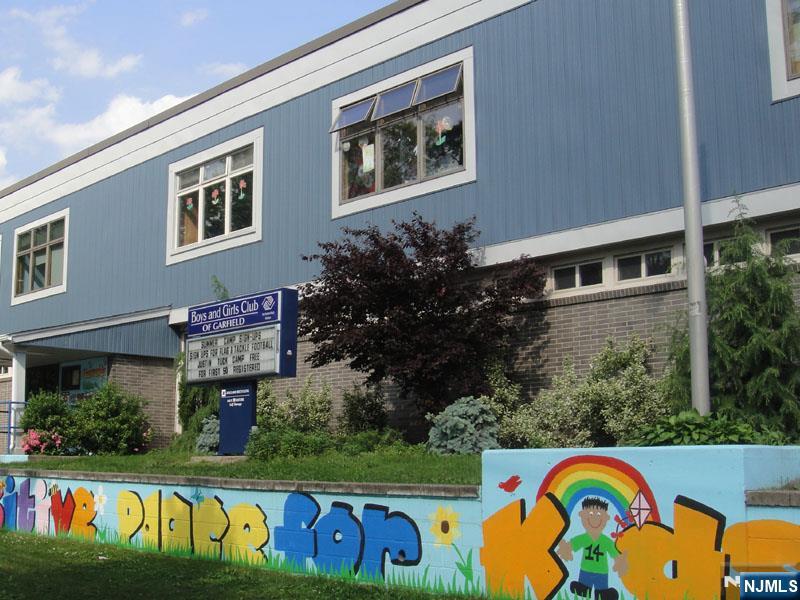 47 Harding Court, Unit 2 Garfield, NJ 07026 - Photo 25 of 34 a front view of a house with garden