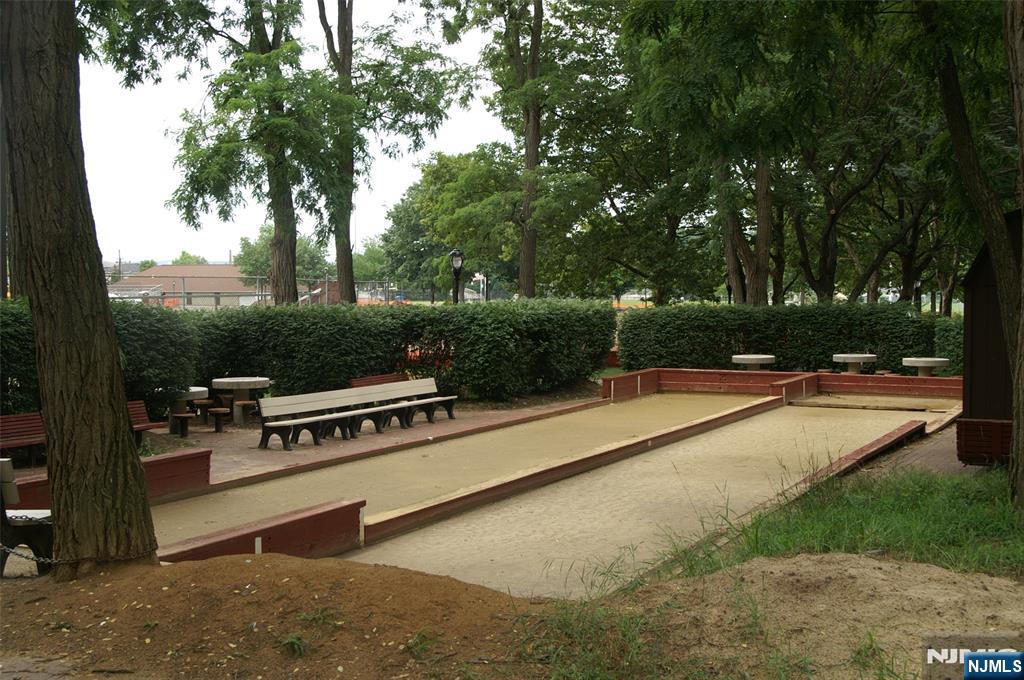 47 Harding Court, Unit 2 Garfield, NJ 07026 - Photo 28 of 34 a view of a terrace with a bench and trees