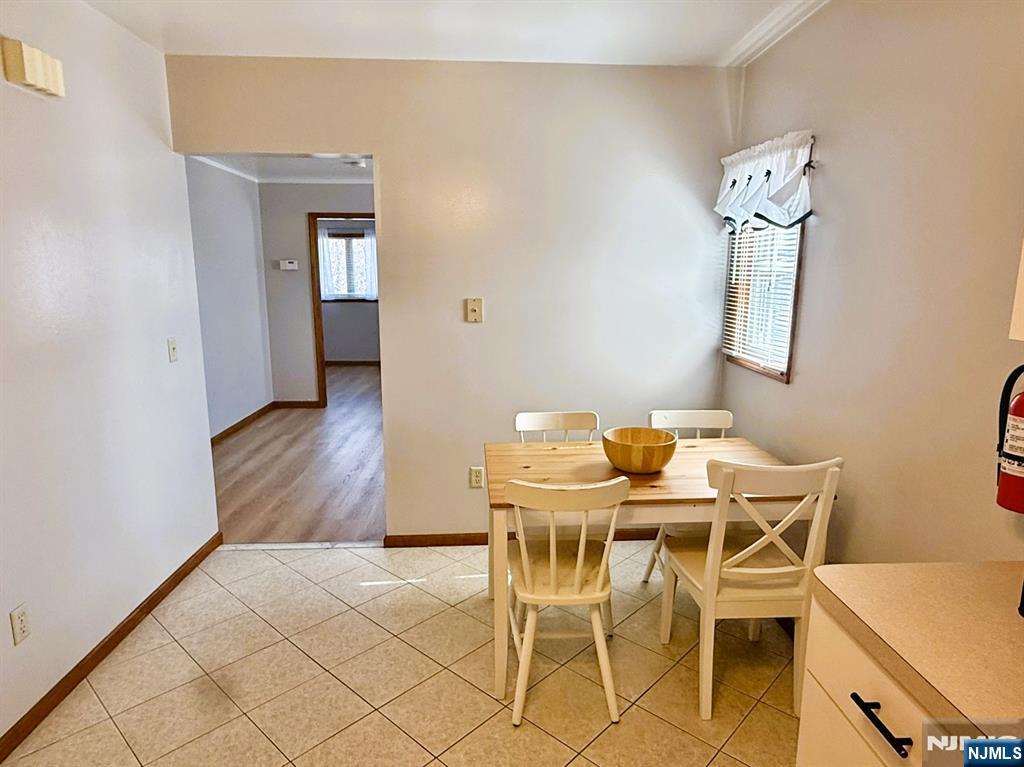 47 Harding Court, Unit 2 Garfield, NJ 07026 - Photo 4 of 34 a view of a dining room with furniture and wooden floor