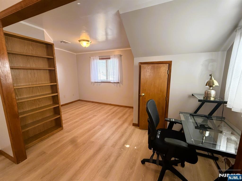 47 Harding Court, Unit 2 Garfield, NJ 07026 - Photo 9 of 34 a workspace with wooden floor and windows