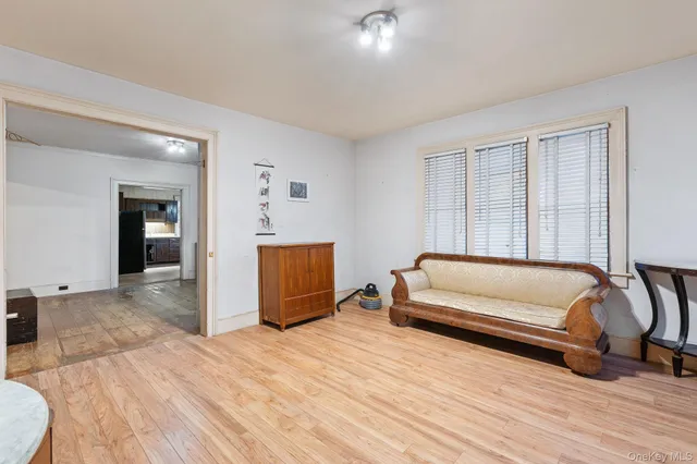 a bedroom with furniture and wooden floor
