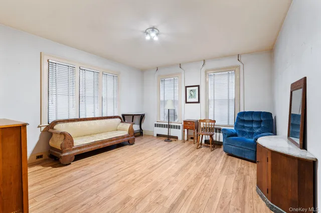 a view of a livingroom with wooden floor and a couch