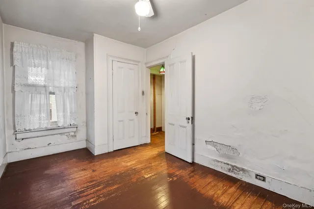 a room with a bed and a window