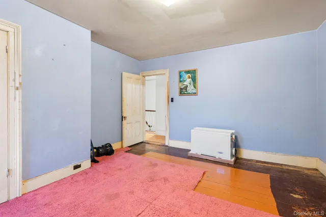 a view of room with wooden floor and window