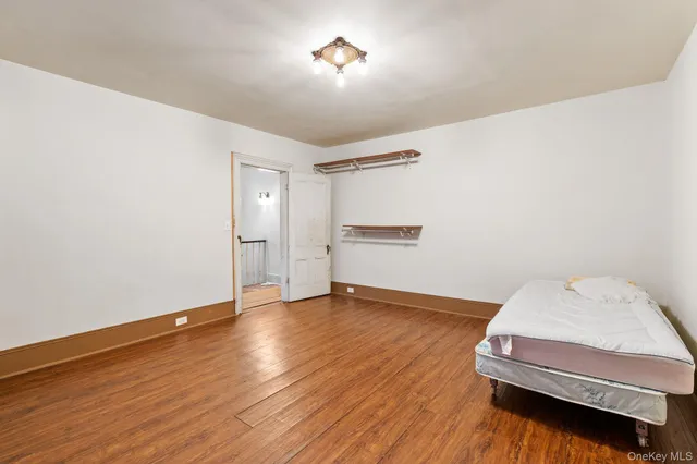 a bathroom with a toilet and a shower curtain